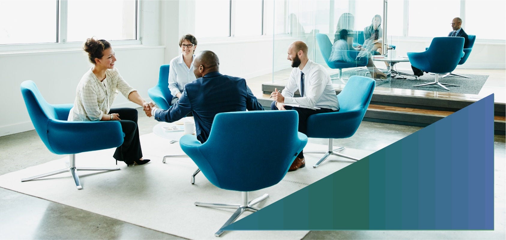 Privacy professionals meeting with clients in an office lounge.